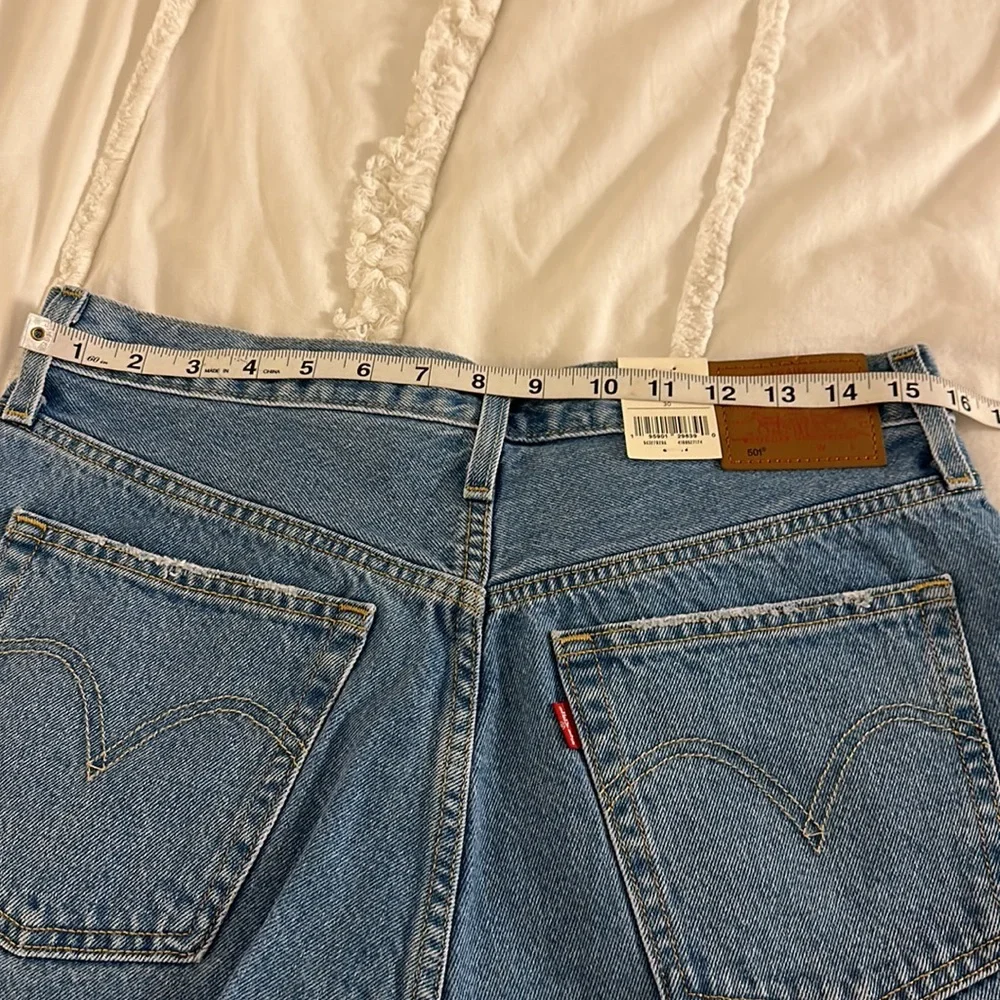 NWT Levi’s 501 denim shorts with raw hem. Size 30. Measurements in pics. - Picture 7 of 10